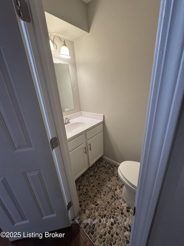 bathroom with vanity and toilet