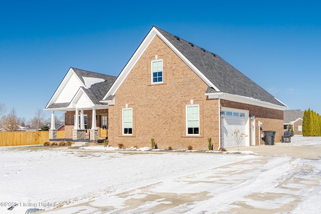 exterior space featuring a porch and a garage