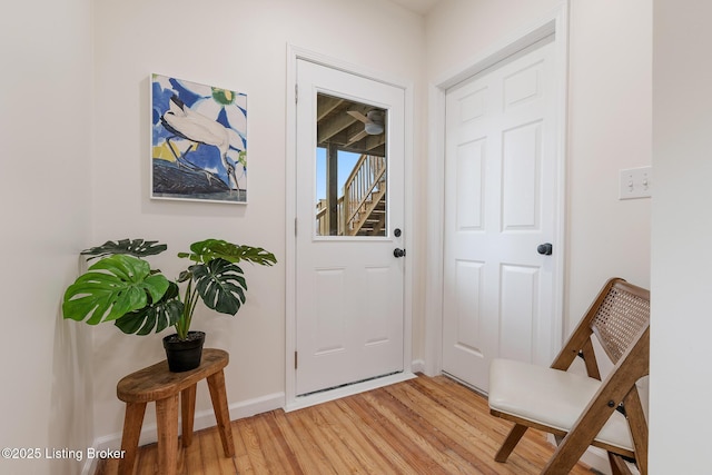 doorway with hardwood / wood-style floors