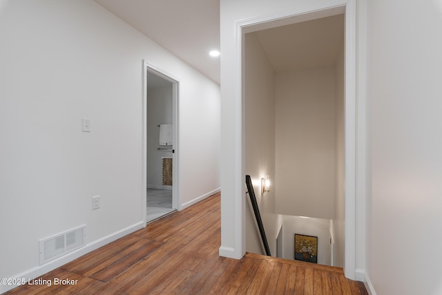 hallway featuring wood-type flooring