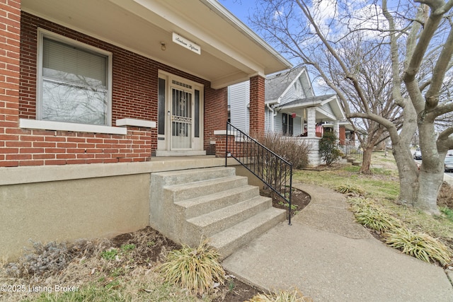1615 Stevens Ave, Louisville, KY 40205 - doorway to property featuring covered porch and brick siding