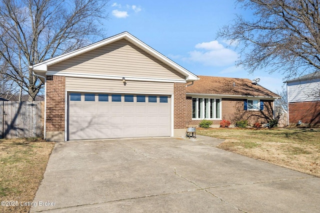 single story home featuring a garage and a front lawn