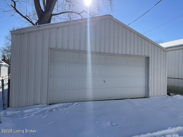 view of snow covered garage