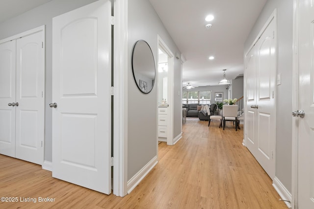 hall with light wood-type flooring