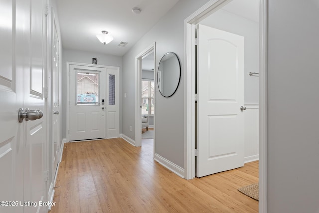 entrance foyer with light hardwood / wood-style flooring