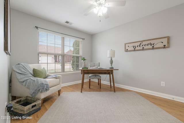 office area with wood-type flooring and ceiling fan