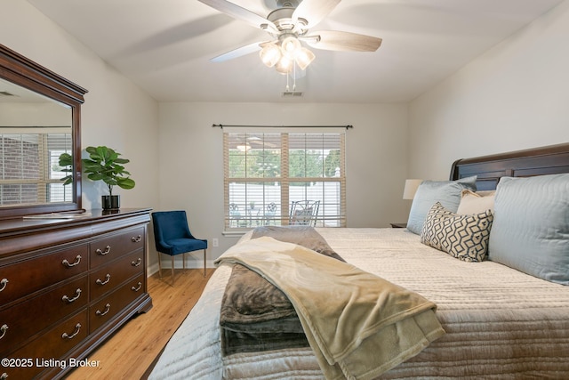 bedroom featuring ceiling fan and light hardwood / wood-style floors