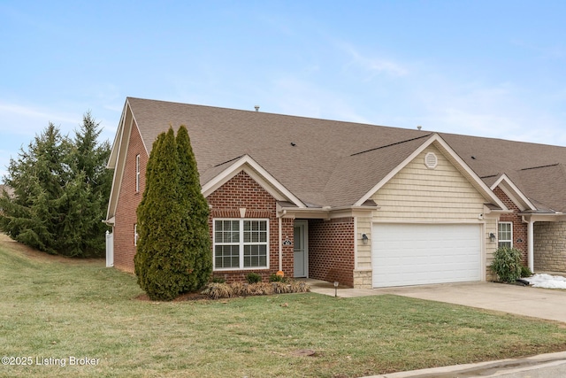 view of front of property with a garage and a front lawn