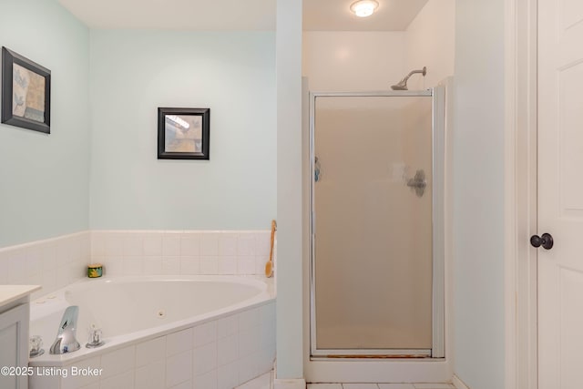 bathroom featuring shower with separate bathtub and vanity