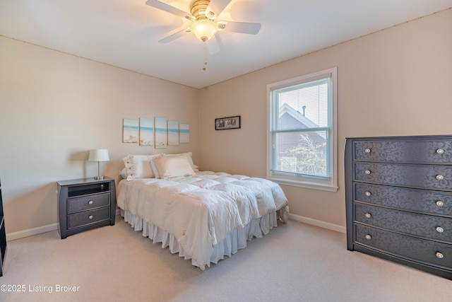 bedroom featuring ceiling fan and light colored carpet