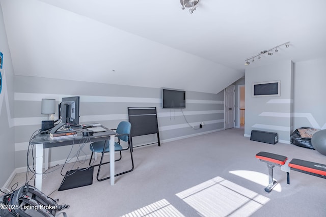 carpeted office space with lofted ceiling and rail lighting