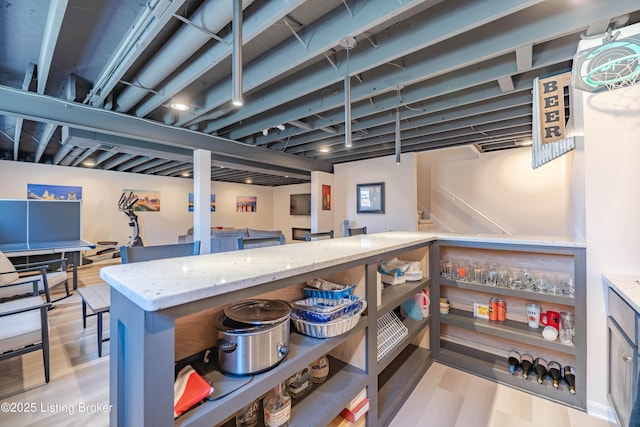 basement featuring light wood-type flooring