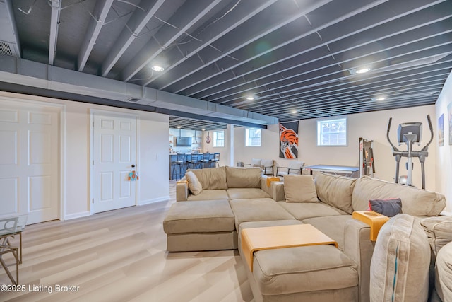 living room featuring indoor bar and hardwood / wood-style floors