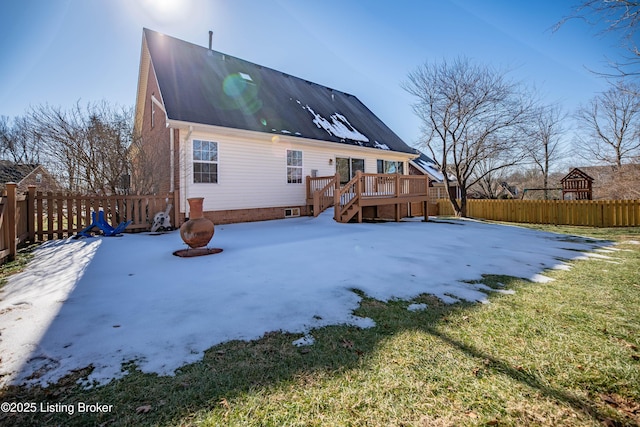 rear view of house with a yard, a deck, a fire pit, and a patio area