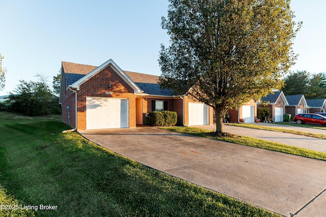 ranch-style house featuring a garage and a front lawn