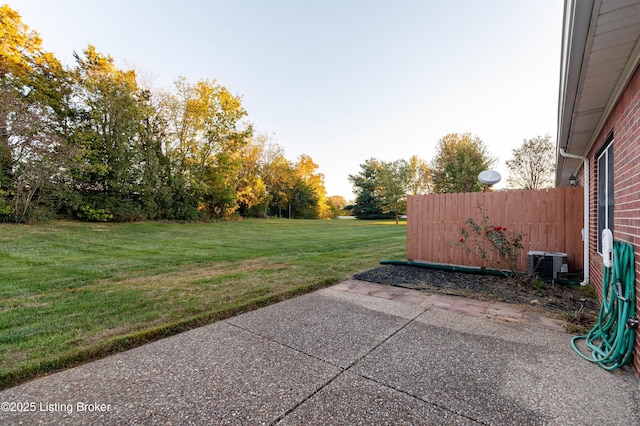 view of yard with a patio area and central air condition unit