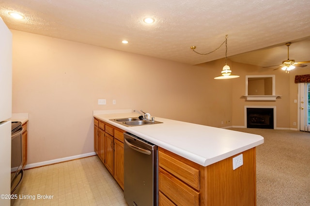 kitchen with sink, hanging light fixtures, a textured ceiling, dishwasher, and kitchen peninsula