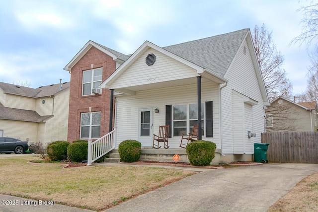 view of front of house featuring a porch and a front lawn