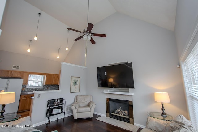 living room featuring high vaulted ceiling, dark wood-type flooring, and ceiling fan