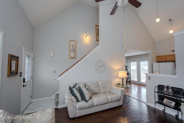 living room with ceiling fan, wood-type flooring, and high vaulted ceiling