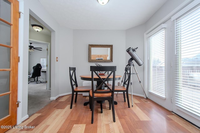 dining area featuring light wood-type flooring