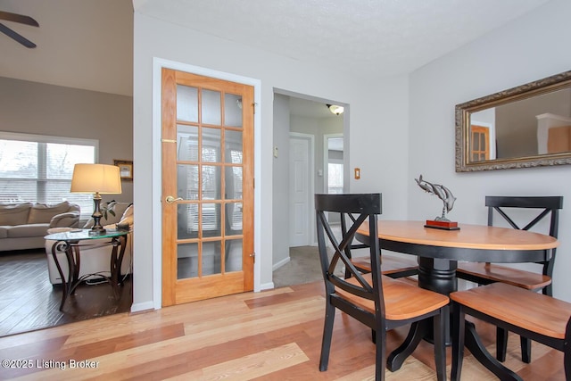 dining area featuring ceiling fan and light hardwood / wood-style floors