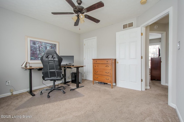 carpeted home office with ceiling fan