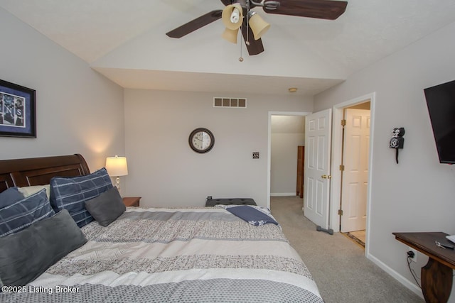 bedroom with lofted ceiling, light colored carpet, and ceiling fan