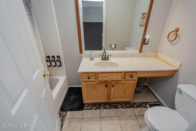 bathroom with vanity, tile patterned floors, and toilet