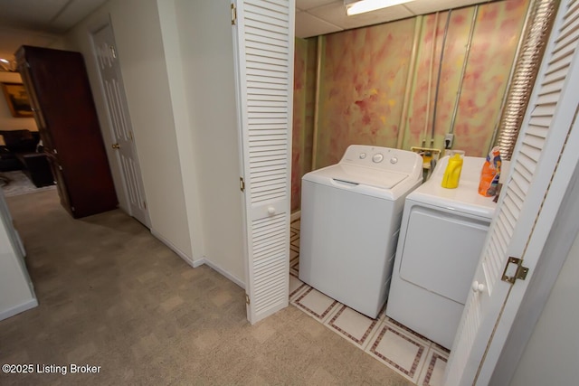 laundry area with carpet flooring and separate washer and dryer