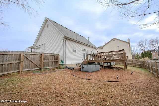 back of property featuring a deck