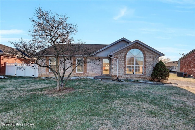 single story home with central AC and a front lawn