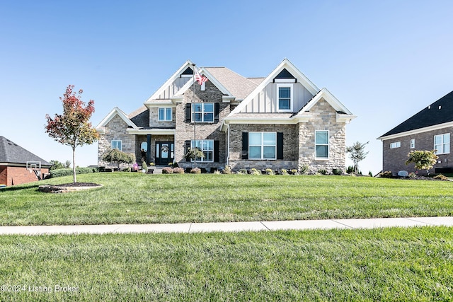 craftsman inspired home with board and batten siding and a front yard