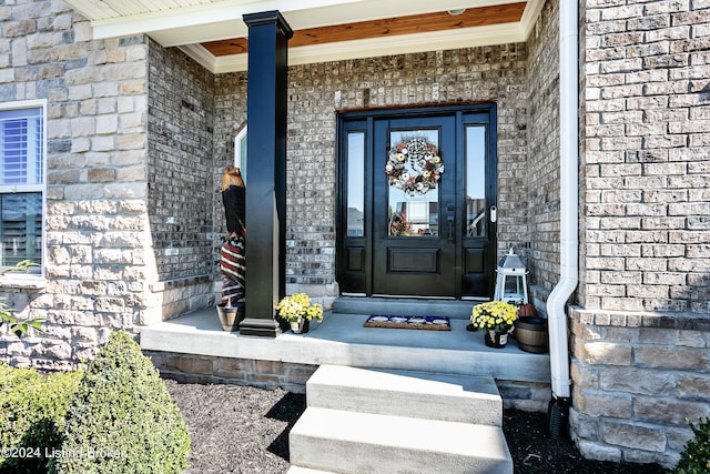 property entrance with brick siding