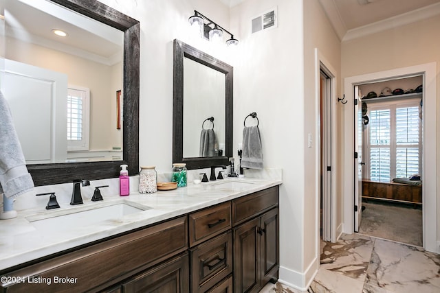 bathroom with ornamental molding and vanity