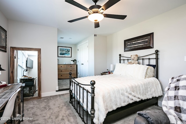 bedroom with light colored carpet and ceiling fan