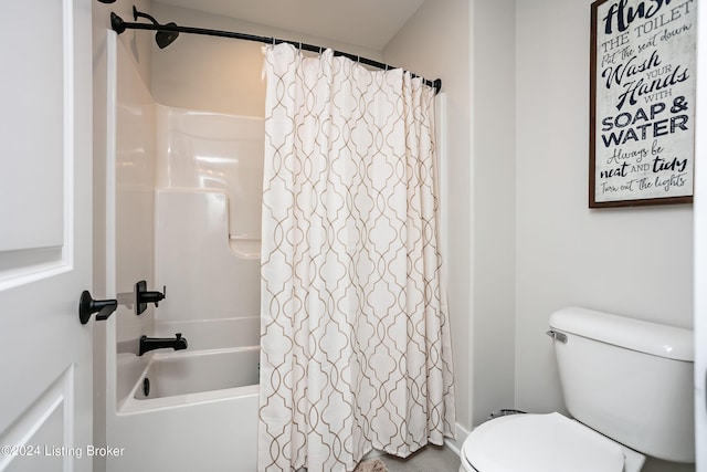 bathroom with shower / tub combo and toilet