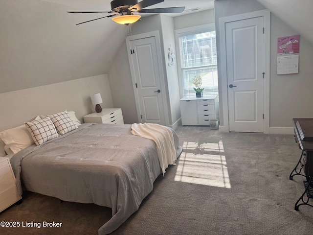 bedroom featuring vaulted ceiling, carpet flooring, a ceiling fan, and baseboards