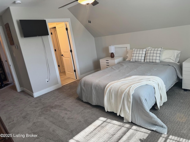 carpeted bedroom featuring vaulted ceiling, baseboards, and ceiling fan