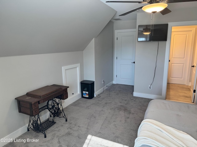 bonus room featuring carpet floors, vaulted ceiling, baseboards, and a ceiling fan