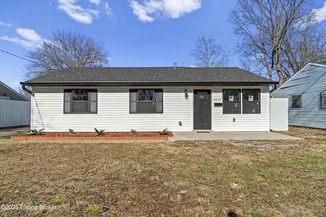 view of front of home with a front yard and a patio