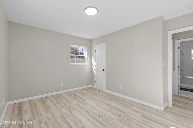 spare room featuring light wood-type flooring