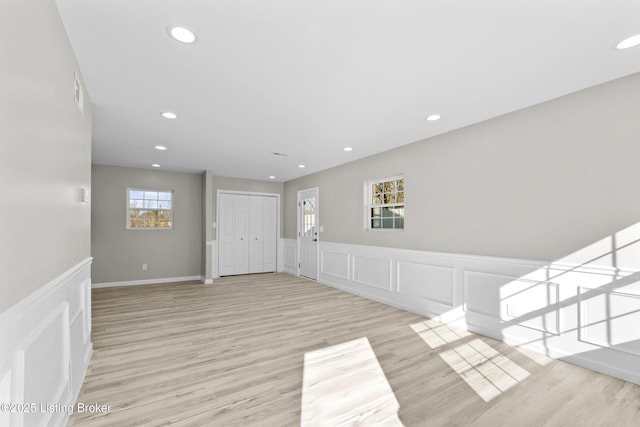 foyer entrance with light wood-type flooring