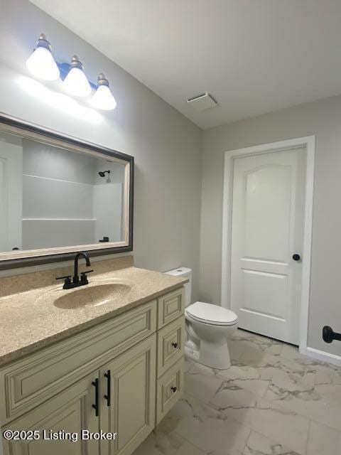 bathroom featuring visible vents, marble finish floor, toilet, and vanity