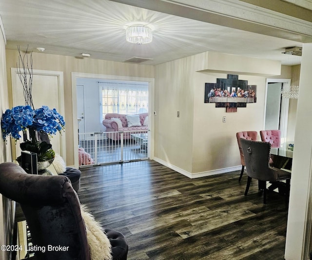 dining space with dark hardwood / wood-style flooring