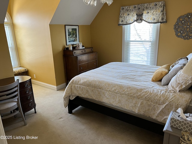 carpeted bedroom featuring lofted ceiling