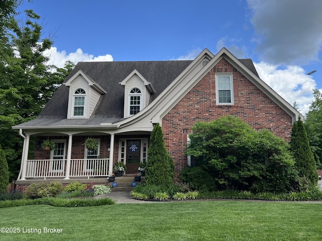 view of front of house featuring a porch and a front yard