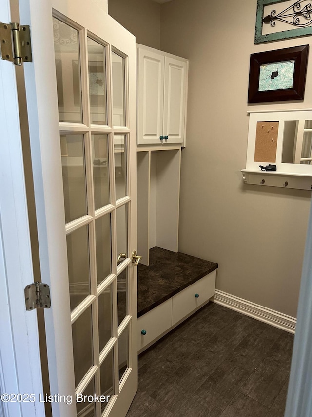 mudroom with dark wood-type flooring