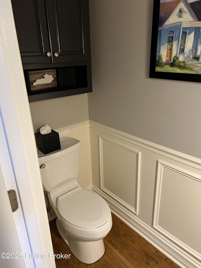 bathroom with wood-type flooring and toilet