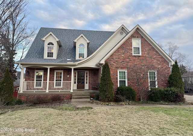 view of front of home featuring a front lawn and covered porch